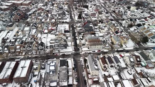 Drone flying over the residential neighborhood of queens in new york city with rooftops and streets