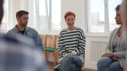 Adults in a Circle Talking in Brightly Lit Room
