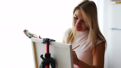 Woman Painting Art on Canvas Indoors