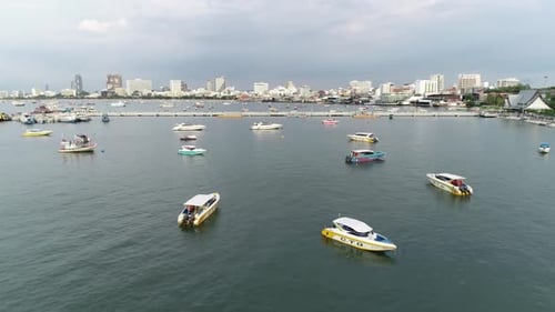 Motorboats Staying Near The Sea Port Surrounded With The Skyscrapers In The City. -aerial shot