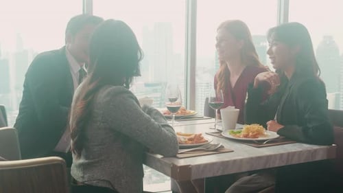 Young Adults Enjoying Lunch Meeting in Urban Setting