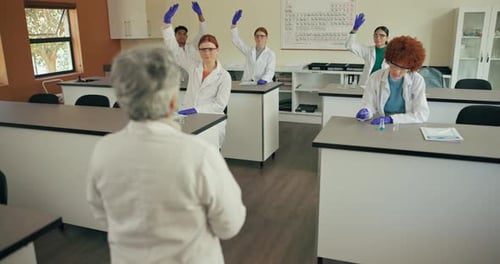 Science Teacher with Students in Classroom