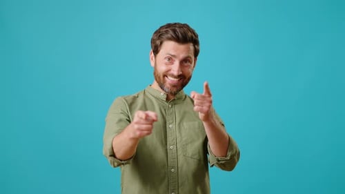 Energetic Man Points and Gestures Cheerfully