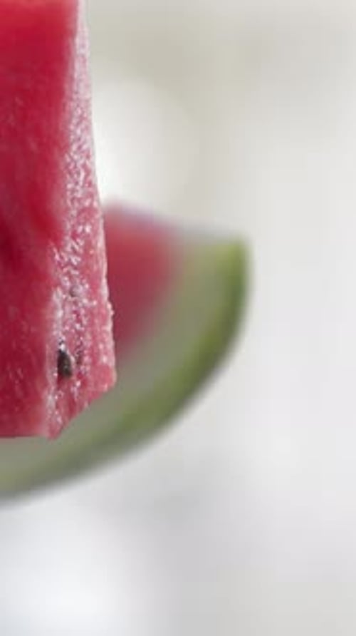 Fresh Watermelon Slices Falling into Water