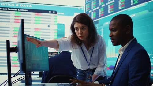 Business Team Analyzing Stock Data in Modern Office