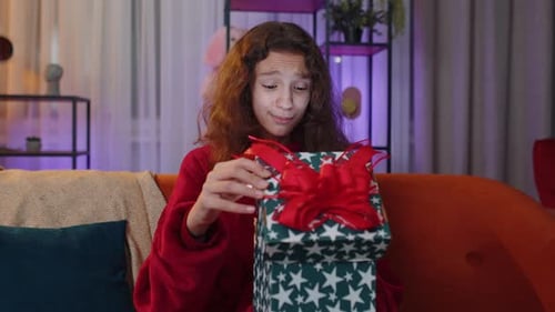 Preteen Girl Opening Gift Box with Light Glow Inside Amazed Satisfied with Present Birthday Surprise