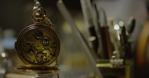 A pocket watch is spinning its gears
