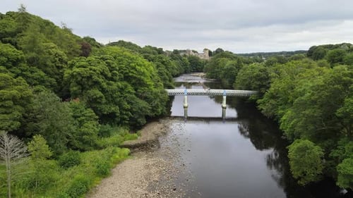 Footbridge over River Tees Barnard Castle UK Aerial footage