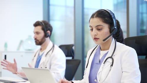 Team of doctors in headset working in online call center healthcare service using laptop. Medical