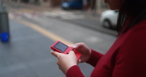 Asian Woman Playing With Vintage Device Outdoor - City Lifestyle And Gaming