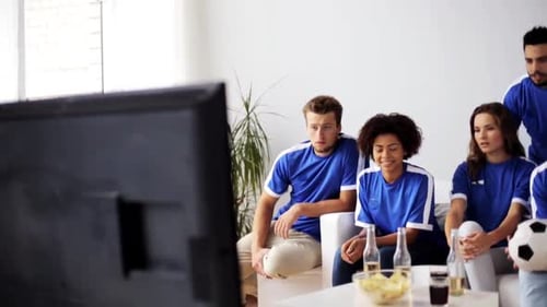 Friends Cheer While Watching Soccer Game on TV