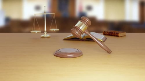 Gavel Resting on Block in Courtroom