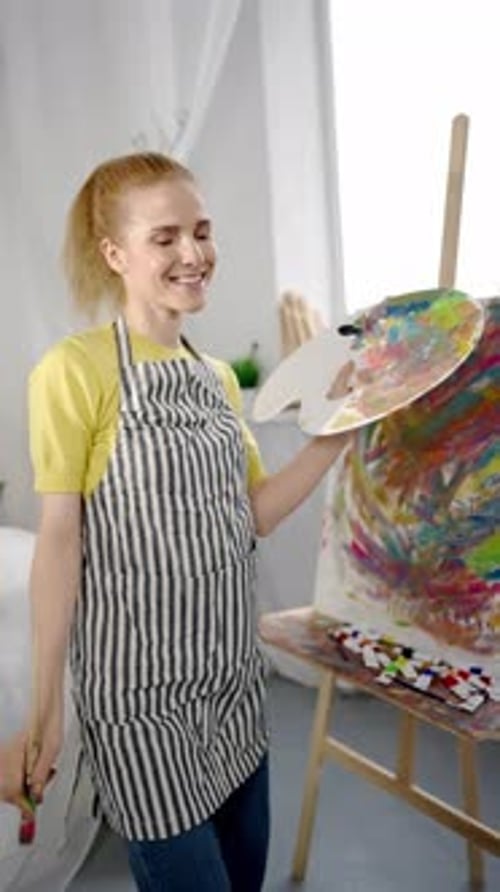 Cheerful Woman Artist Dancing and Drawing By Music in Art Studio Vertical Video Portrait Inspiration