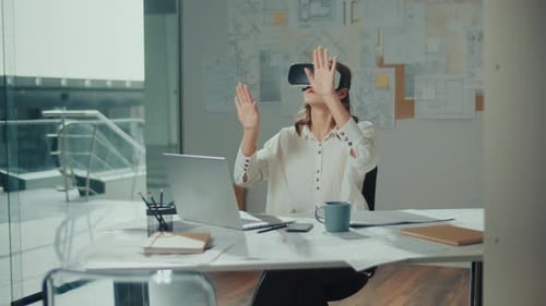 Woman Wearing VR Glasses Sits in a Bright Office Innovative Technologies