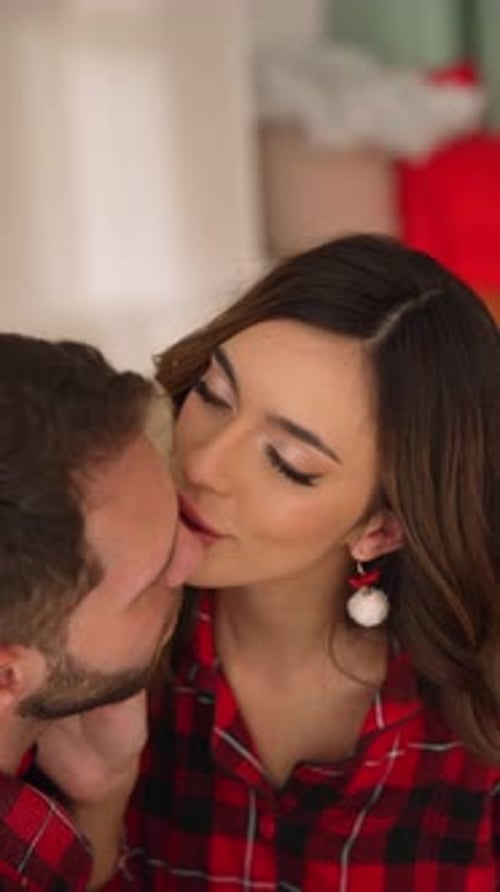 Loving Couple Kissing at Christmas time