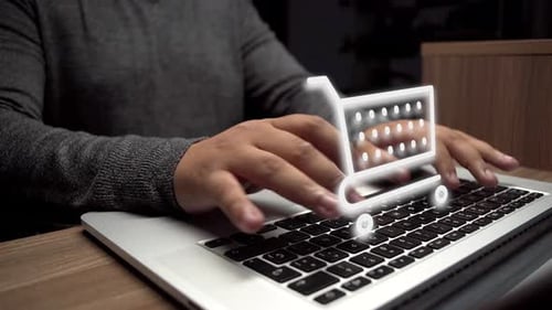 Person Typing on Laptop with Shopping Cart Icon
