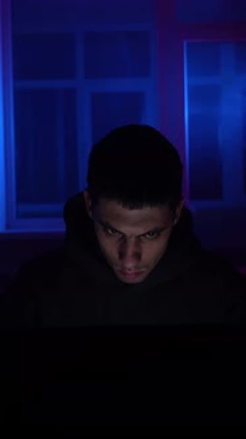 Young Adult Works on Computer Late at Night