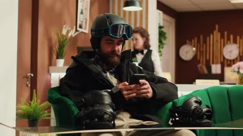 Person Texting Messages Before Skiing