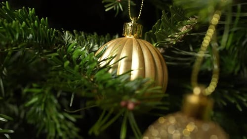 Decorative Gold Bauble on Christmas Tree