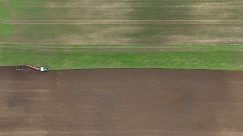Aerial view of tractor ploughing in Brandenburg, Germany.