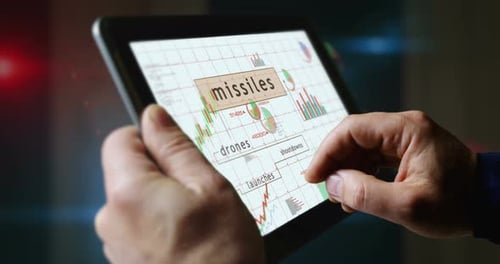 Missiles drones charts graphs on touchscreen pad display