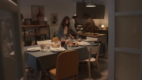 Family Prepares Dinner Together in Warm Home