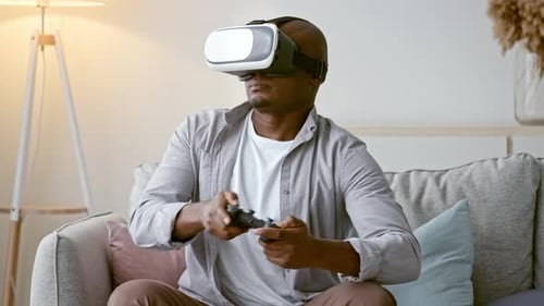 Man Enjoys Virtual Reality Gaming at Home