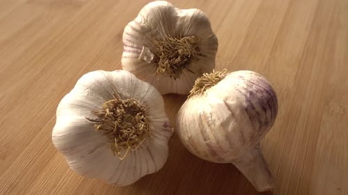 Garlic in Rotation on Wooden Background