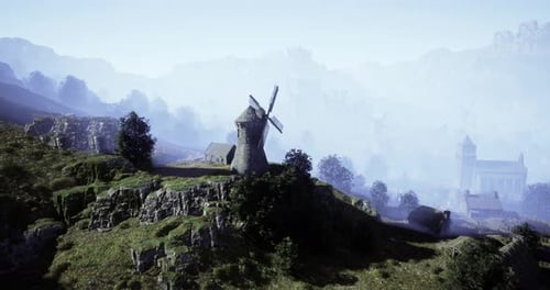 Windmill Stands Alone on a Hill Overlooking a Misty Valley at Dawn