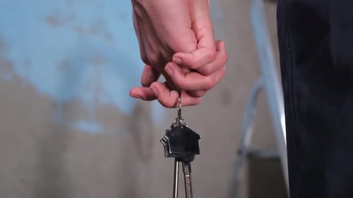 Own Home Mortgage Relocation Concept Couple Hands Holding Key From New First House Family