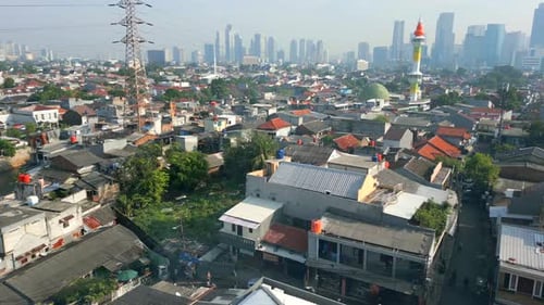 Aerial View of Jakarta City Skyline with Dense Housing and Modern Skyscrapers