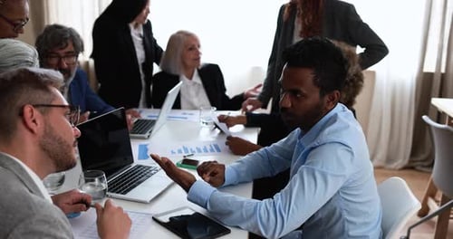 Multiracial Business People Working Inside Bank Office - Meeting and Startup Concept Analysis