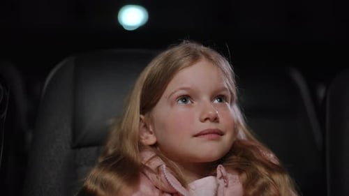 Little Girl Covers Her Face During Scary Scene in Cinema