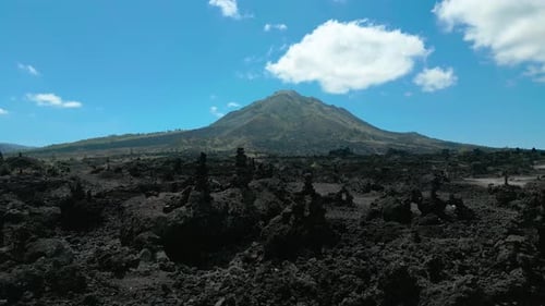 Aerial View of a Black Solidified Lava Flows Around an Active Volcano Mount Batur Bali Indonesia