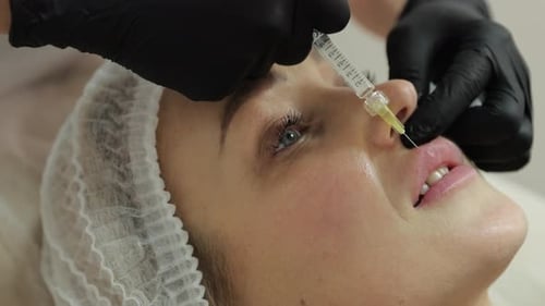 Woman Receiving Lip Augmentation Injection Procedure