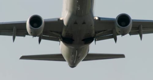 Commercial Airplane Ascending from Airport Runway During Day