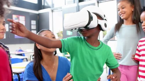 In school, children using VR headset with teacher guiding in classroom activity