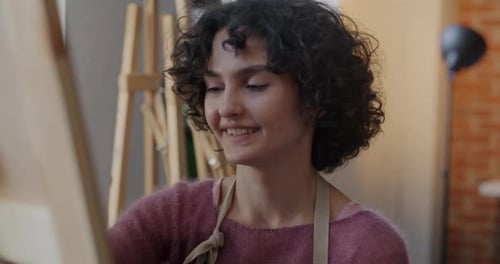 Woman Painting in Art Studio