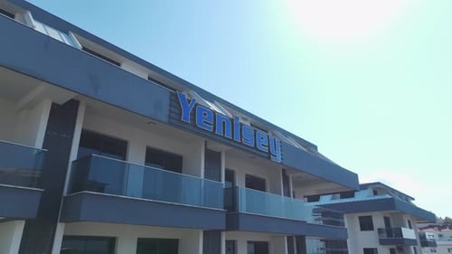 Aerial View Residential Complex With Azure Pool and Kids' Slides By the Mediterranean Coast