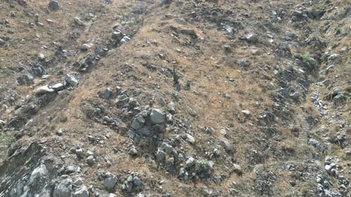 Aerial birdseye panning shot up from the beautiful mountains in matacuna lima peru with a wide view