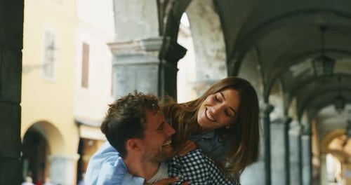 Woman Gets Piggyback Ride From Man On Vacation