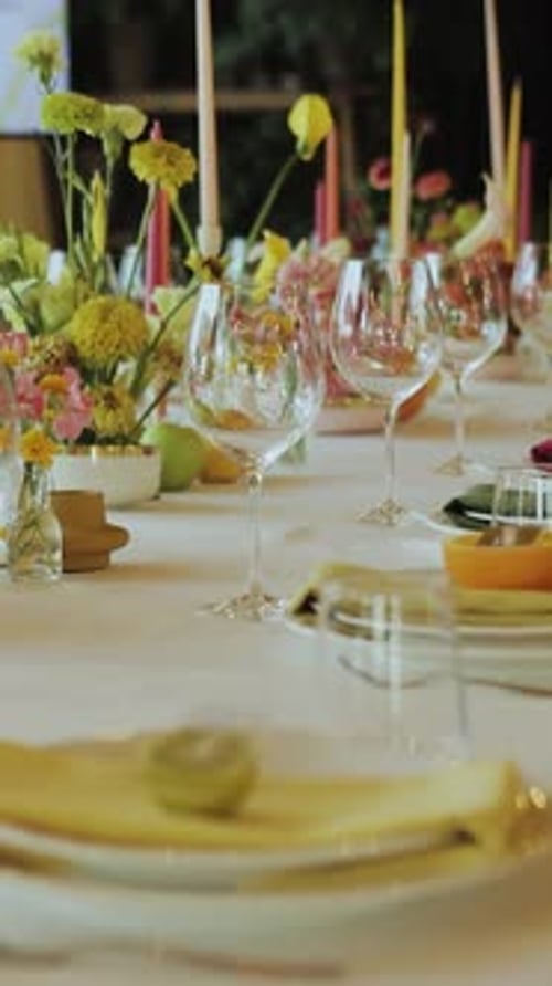 Elegant Wedding Table Setting with Flowers and Candles