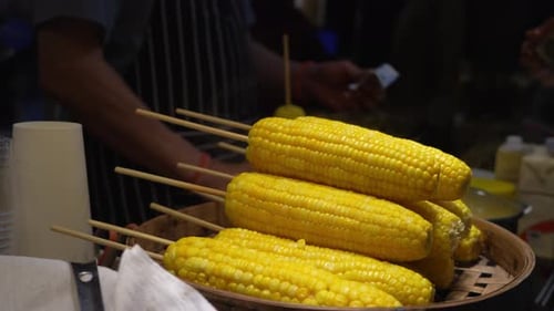 Fresh Corn on Skewers Sold by Street Vendor