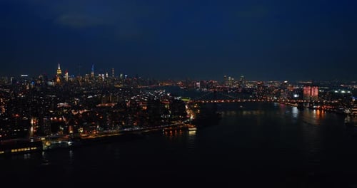 Immense cityscape of never sleeping New York. Breathtaking metropolis with lively traffic at night.