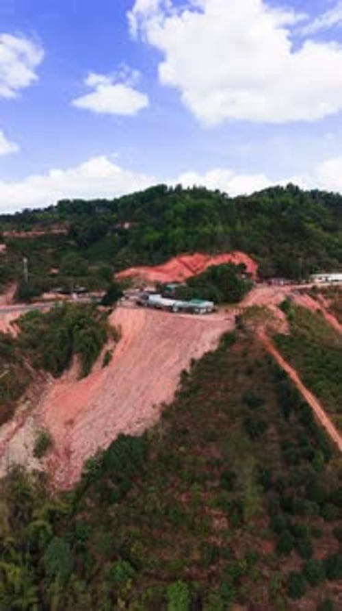 Aerial view of Đại Ninh Pass with landscape and construction activity captured from a drone.
