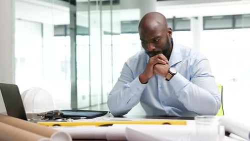 Organized, serious and professional engineer, architect and designer thinking of ideas