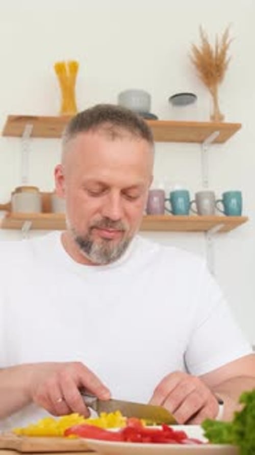 Loving Couple Preparing Vegetables Together in Kitchen