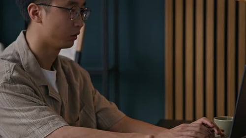 Freelancer Getting Tired of Working on Laptop while Programming in Home Office