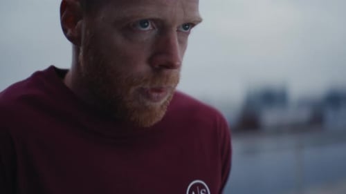 Man with Red Beard Pauses During Workout