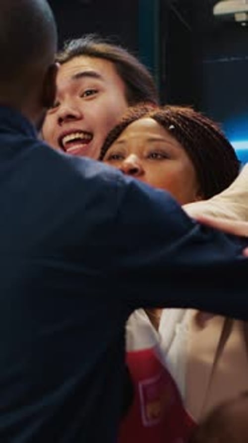 Friends Joyfully Embracing After Shopping on Black Friday